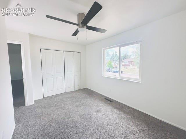 Image 7 of 20: Upper front facing bedroom new closet doors and ceiling fan