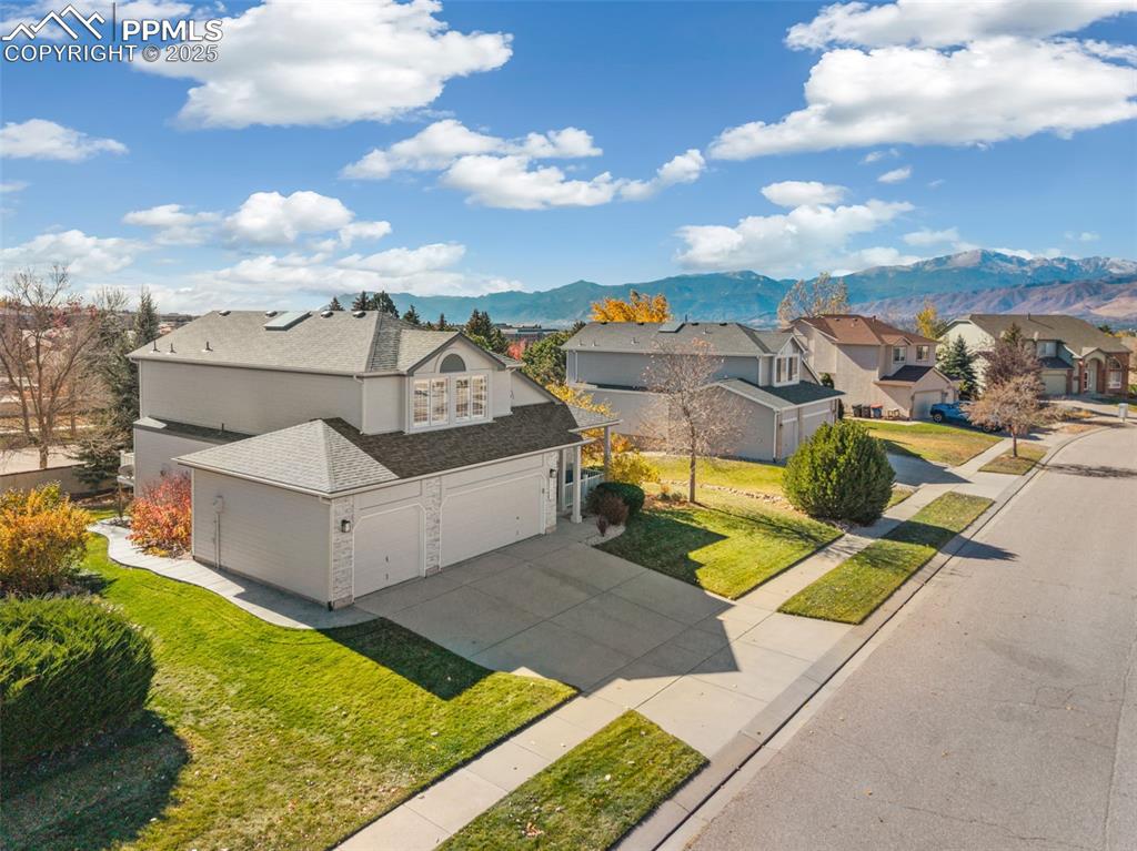 Image 2 of 43: Aerial view of residential area with mountains