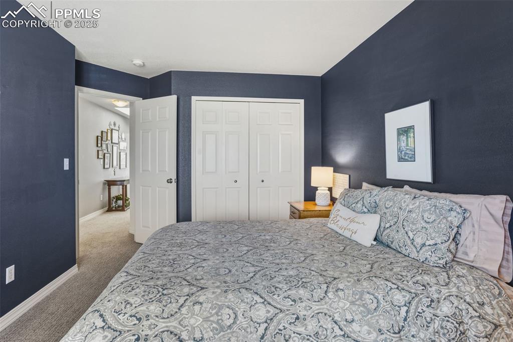 Image 23 of 43: Bedroom featuring light carpet and a closet