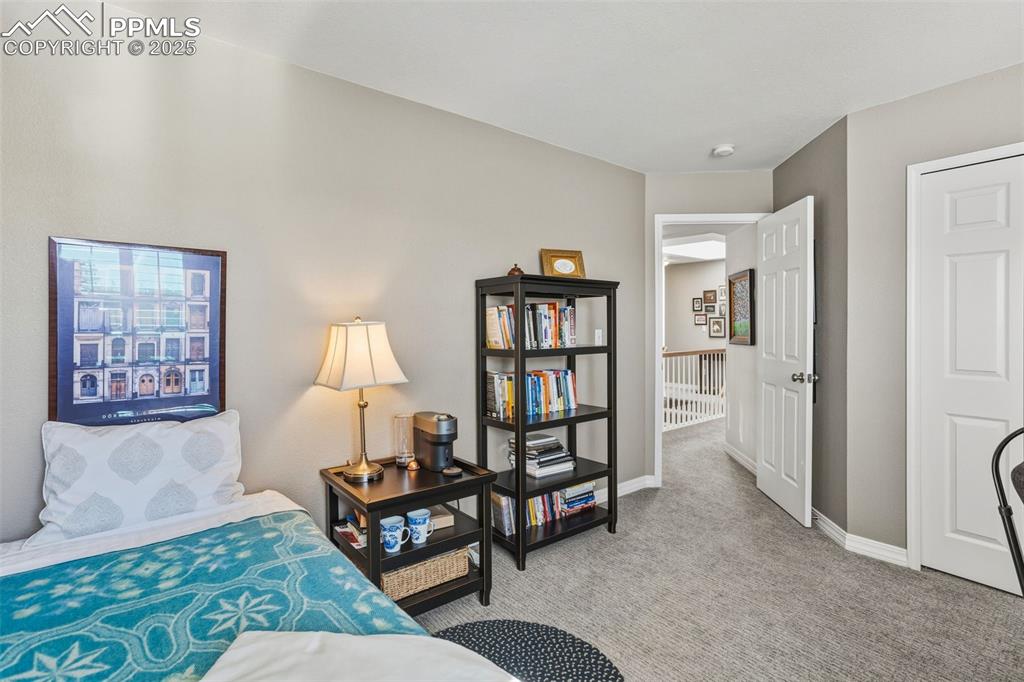 Image 33 of 43: Bedroom with light carpet and baseboards