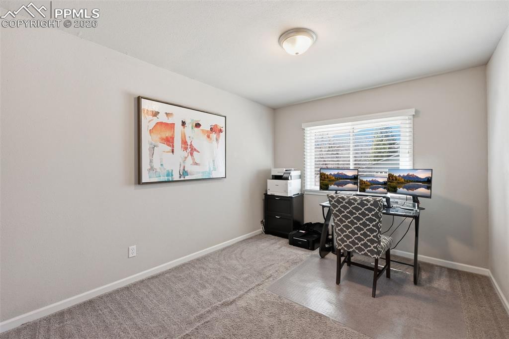 Image 13 of 24: Spacious bedroom or office space