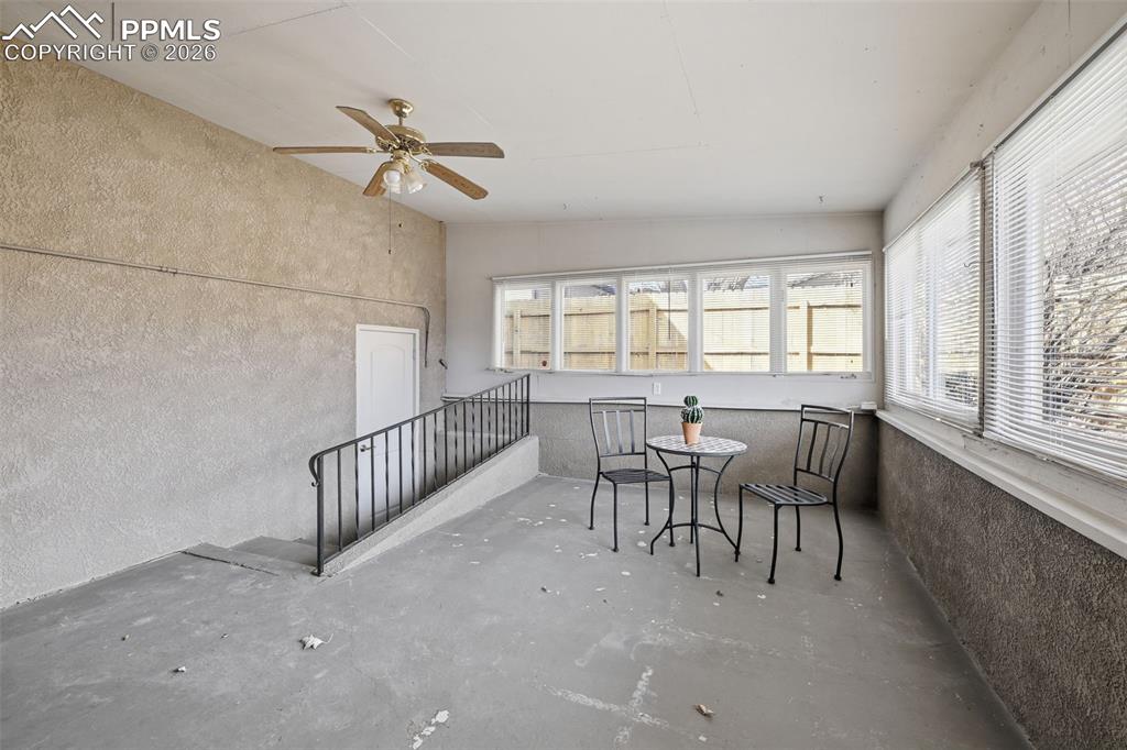 Image 21 of 24: Large sunroom / solarium with vaulted ceilings and access to the back yard