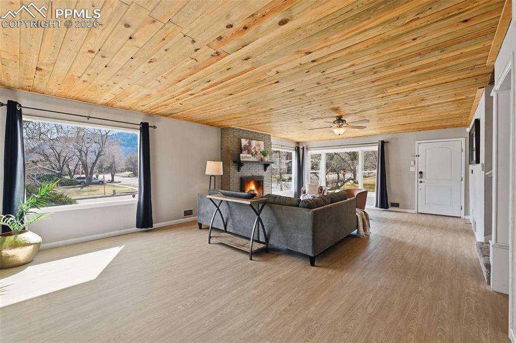 Image 4 of 24: Tons of natural light and stone fireplace