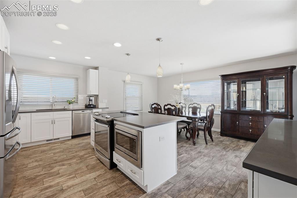 Image 5 of 24: Updated white kitchen and quartz countertops