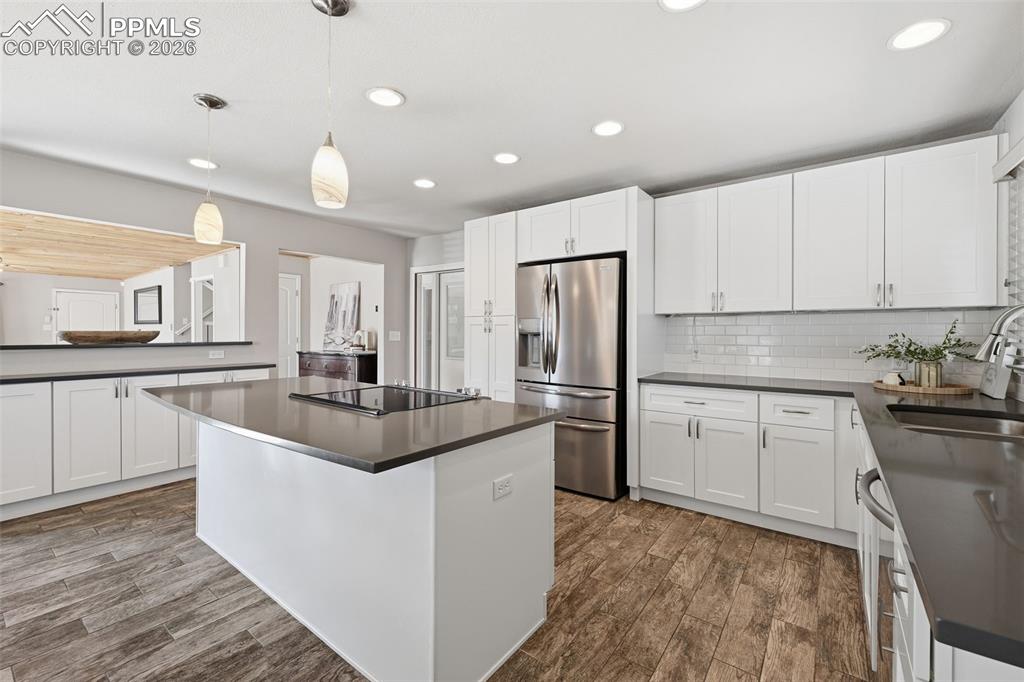 Image 7 of 24: Updated cabinets with pull outs inside