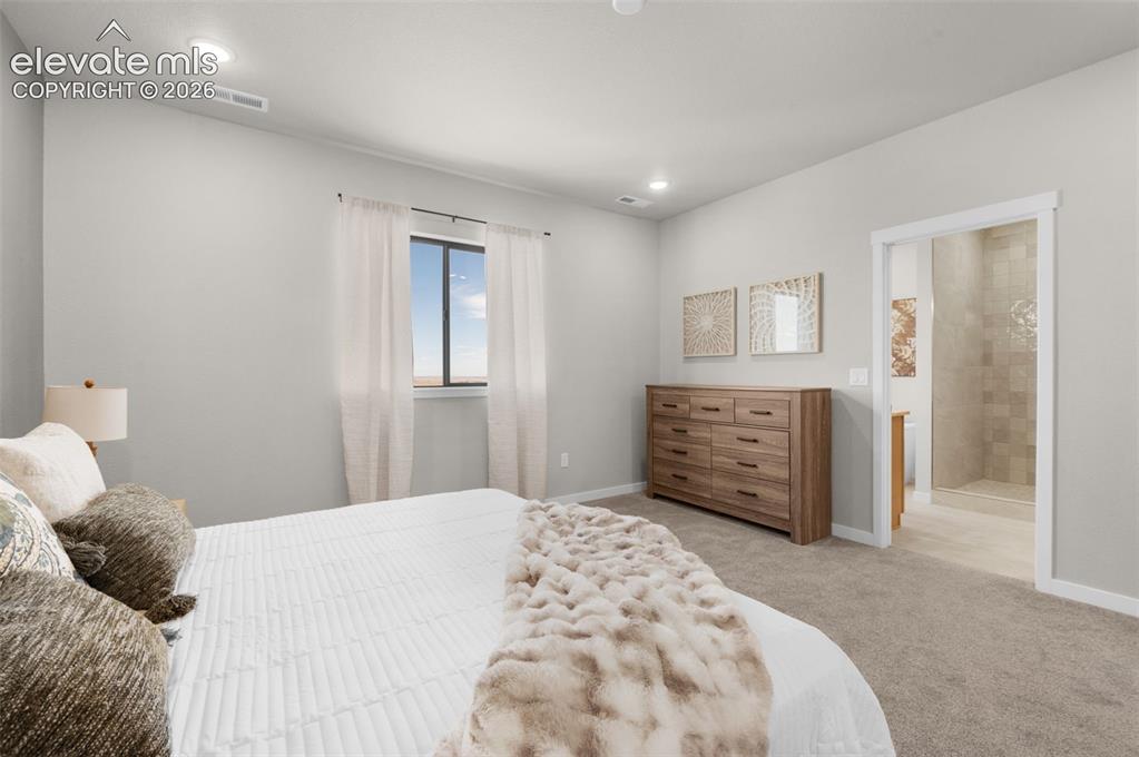 Image 20 of 36: Recessed ceiling lighting, a framed window, light gray wall paint, and carp