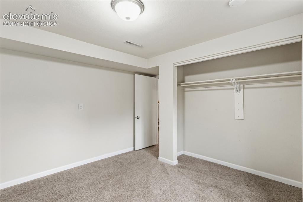 Image 21 of 27: Lower Bedroom #2 with large closet