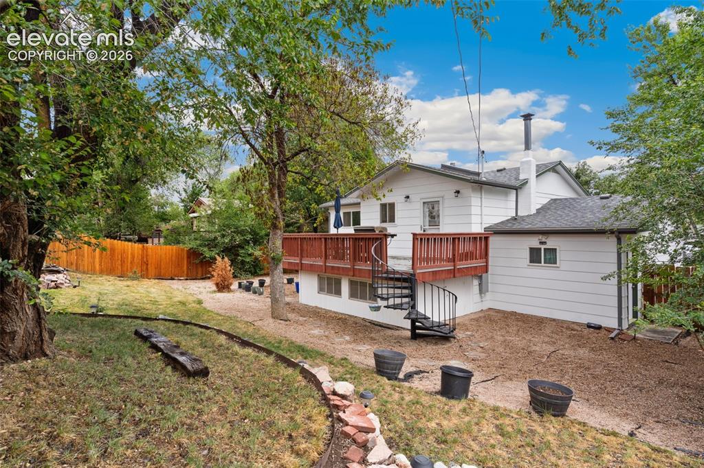Image 23 of 27: Fenced, landscaped, private backyard