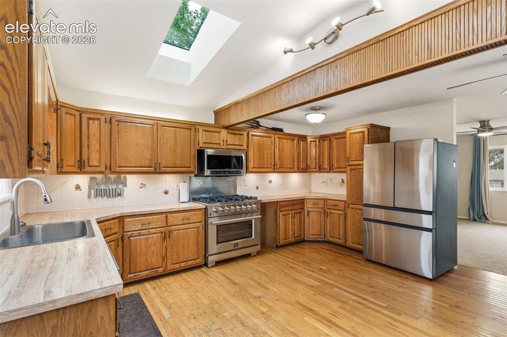 Image 5 of 27: Kitchen featuring stainless appliances