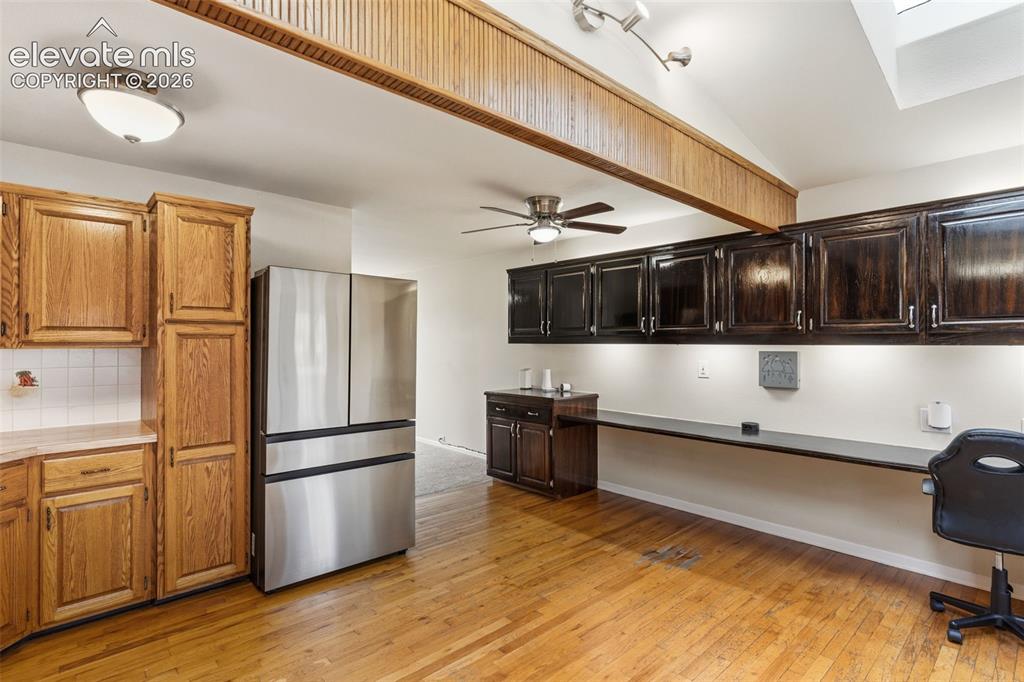 Image 6 of 27: Kitchen featuring extra storage cabinets and desk