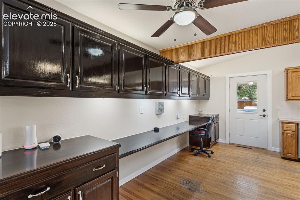 Image 7 of 27: Kitchen featuring extra storage cabinets and desk