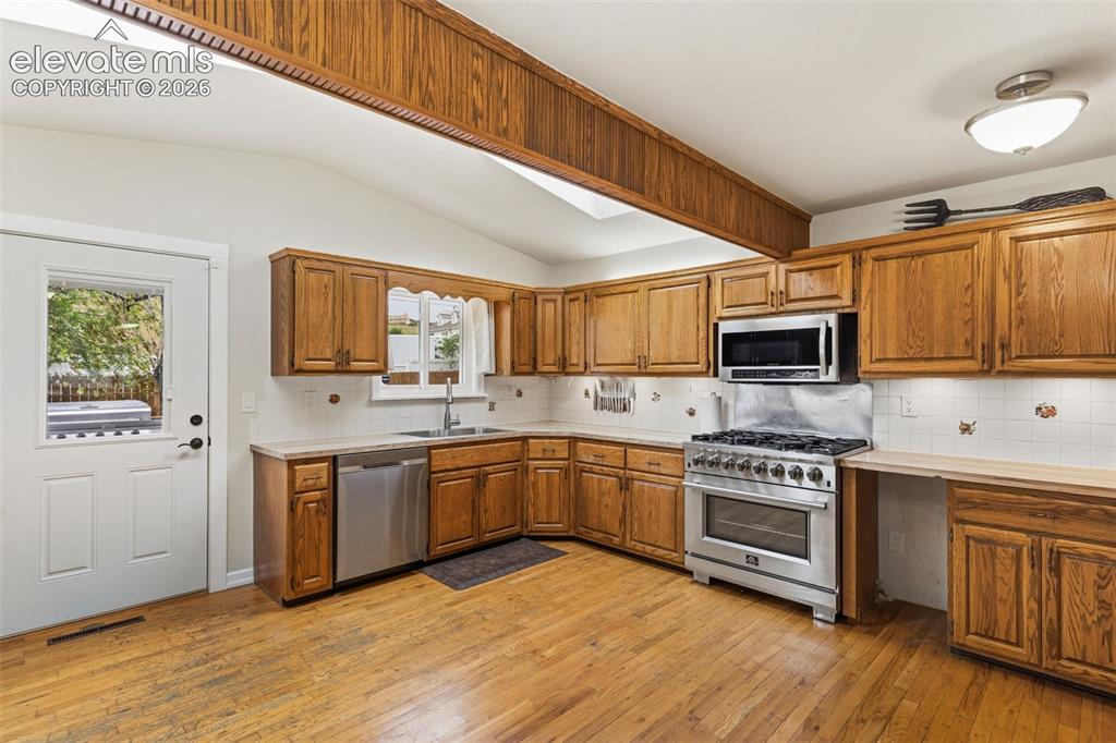 Image 8 of 27: Kitchen featuring stainless appliances