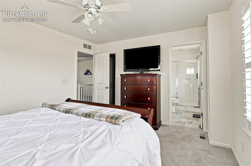 Image 18 of 39: Spacious, bright and airy primary bedroom with walk-in closet