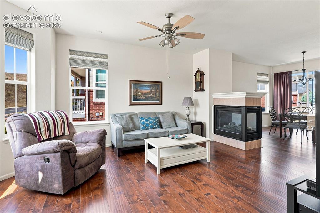 Image 3 of 39: Bright with open floor plan adjacent to kitchen and dining area with gas su