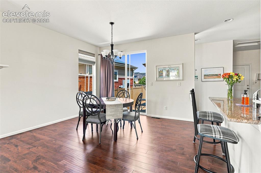 Image 6 of 39: Light, bright, and spacious with other side of wrap around fireplace; overl
