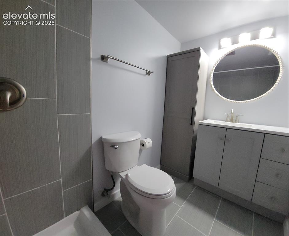 Image 13 of 31: Primary Bathroom featuring light gray wall paint, a white toilet, and gray
