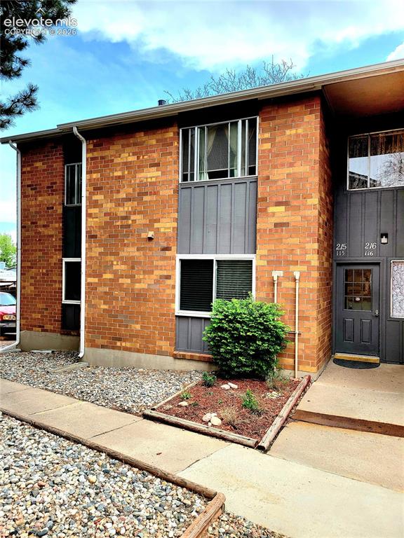 Image 2 of 31: Two-story brick building