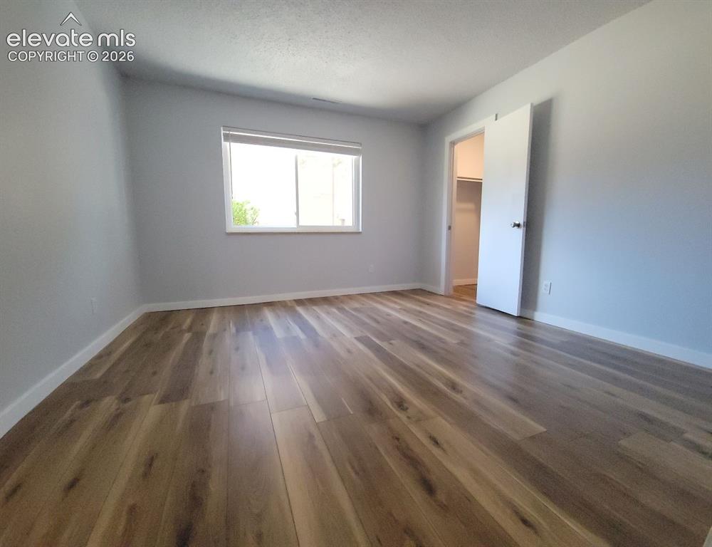 Image 20 of 31: Spacious secondary bedroom featuring walk-in closet