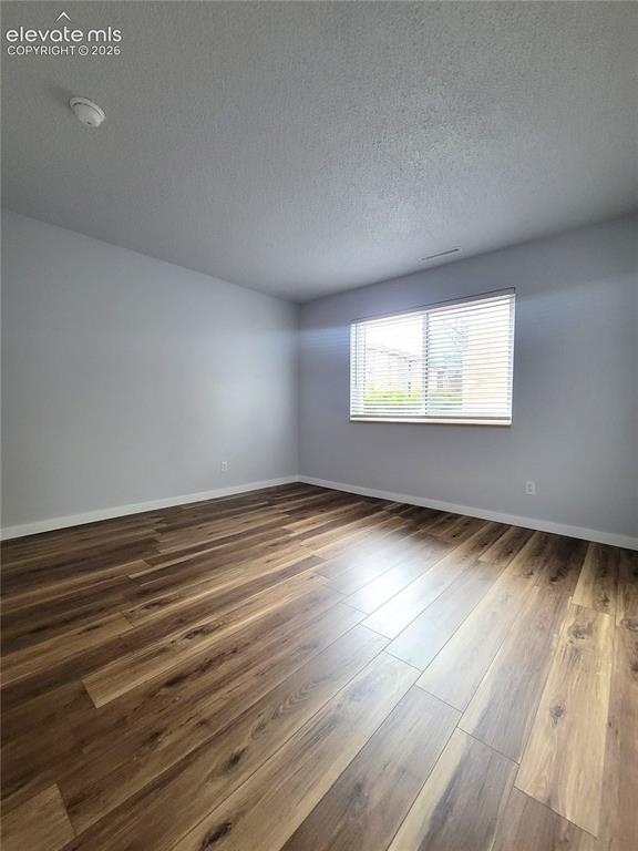 Image 21 of 31: Spacious secondary bedroom featuring walk-in closet