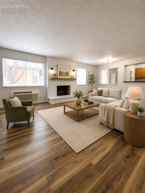 Image 4 of 32: Virtually staged Spacious living area featuring extensive wood-finish floor