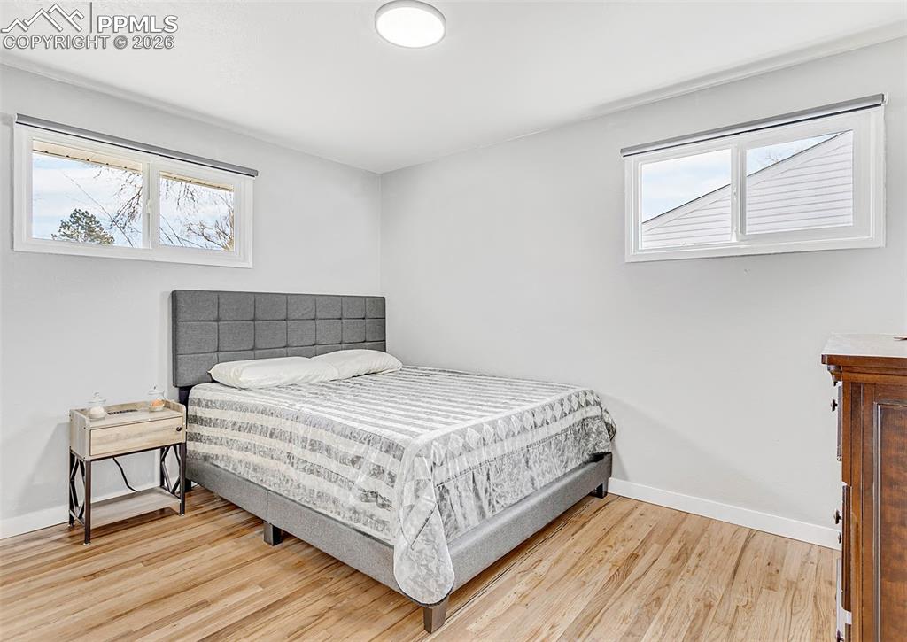 Image 14 of 20: Third bedroom with beautiful hardwood floors.