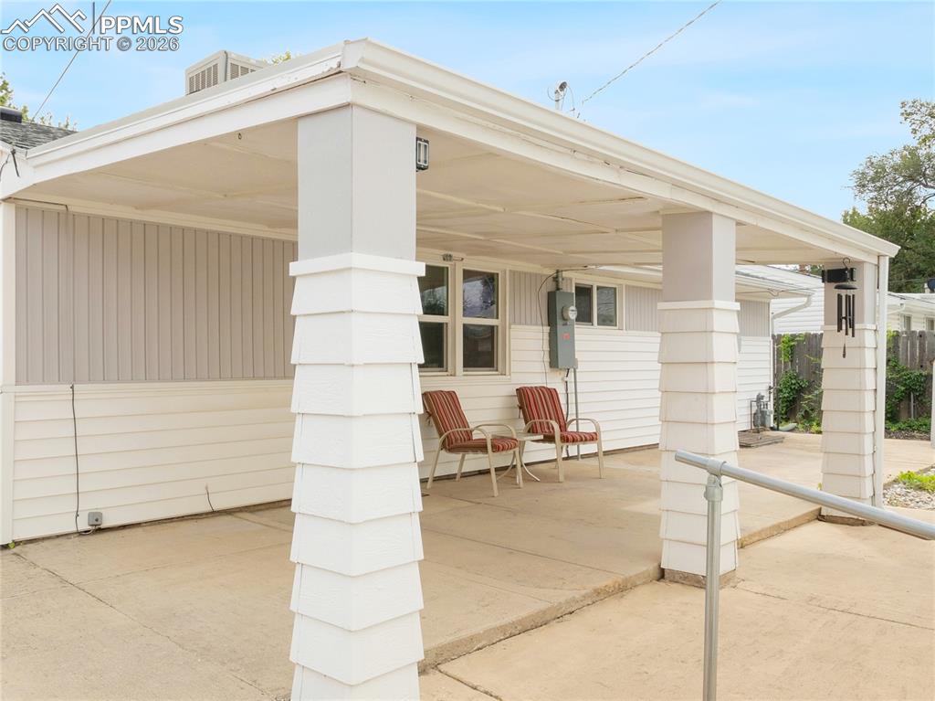 Image 20 of 20: Large covered back patio.