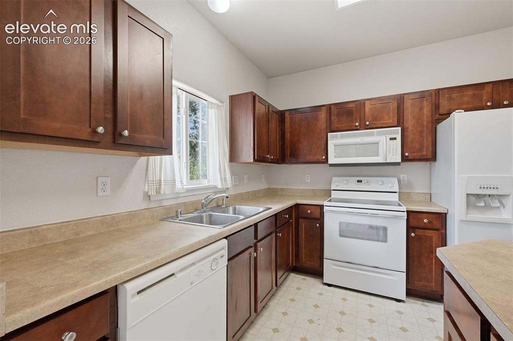 Image 12 of 29: Ample cabinet and countertop space.