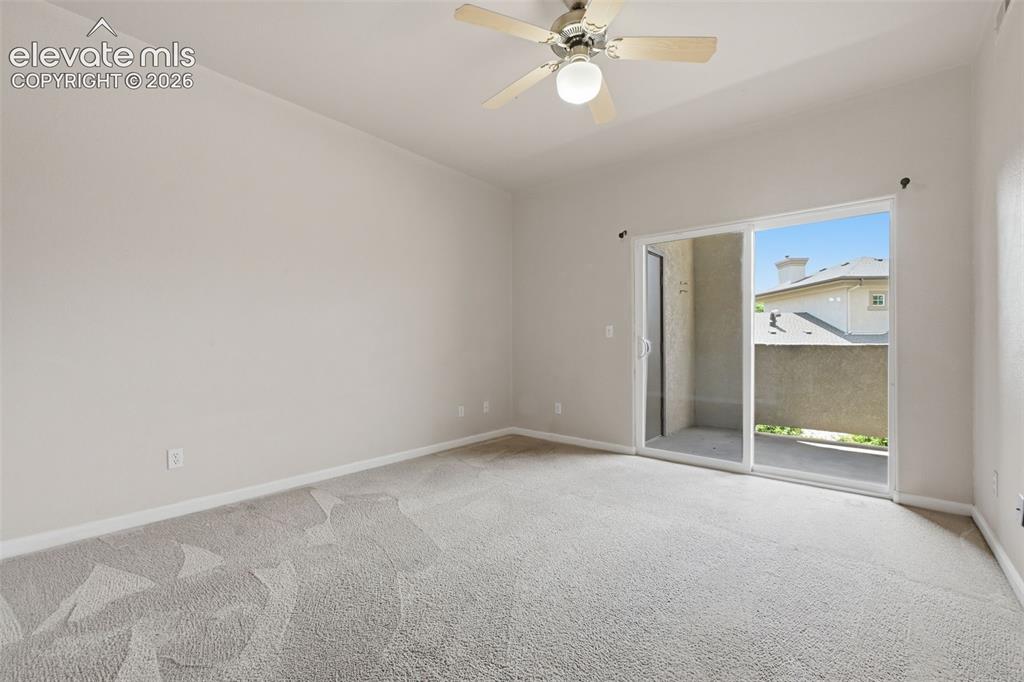 Image 18 of 29: Primary bedroom walks out to the covered patio.