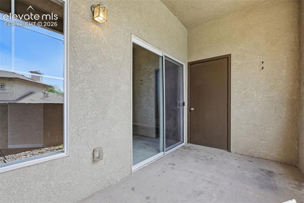 Image 22 of 29: Covered Patio with Storage. 