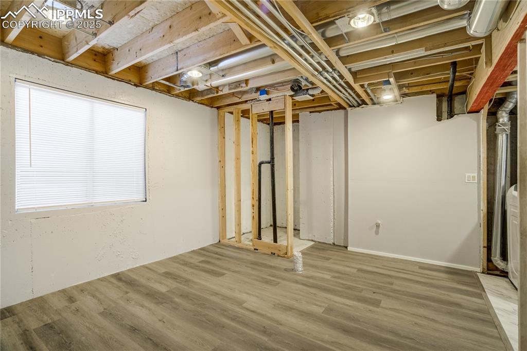 Image 39 of 46: Below grade area featuring wood finished floors