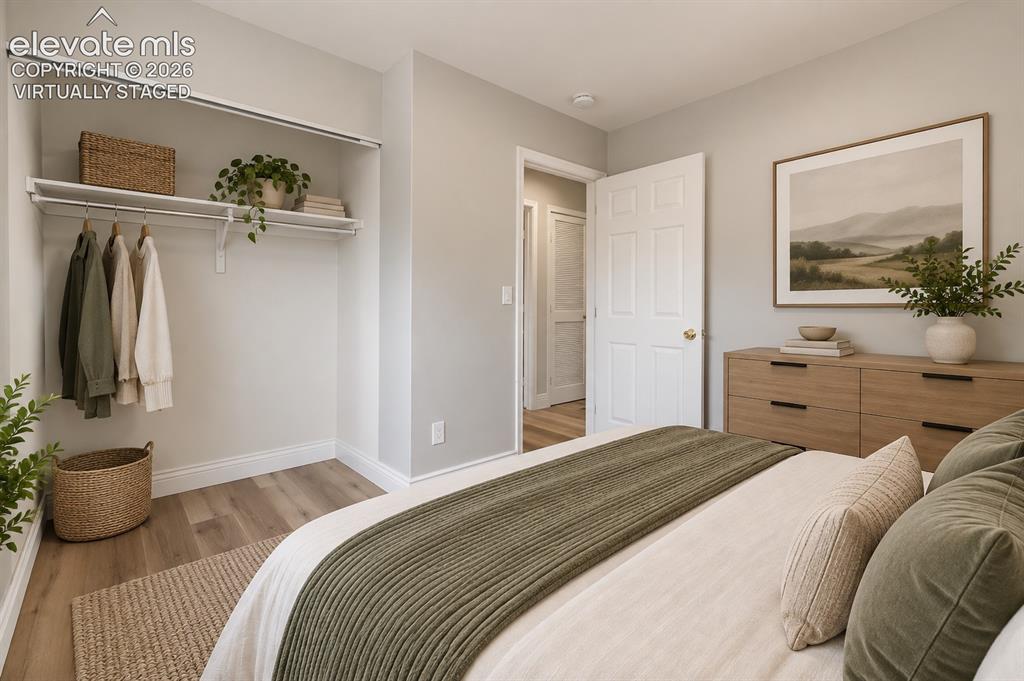 Image 14 of 33: Main Level Bedroom with Laminate Flooring! Virtually staged.