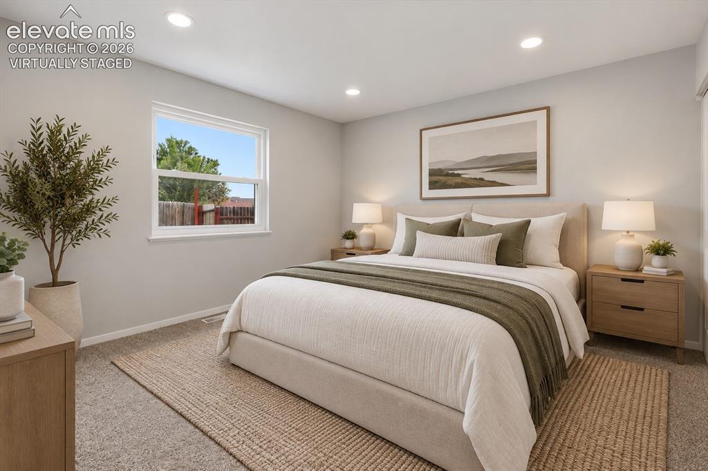Image 16 of 33: Main Level Bedroom with Carpeting! Virtually staged.
