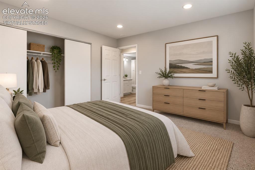 Image 17 of 33: Main Level Bedroom with Carpeting! Virtually staged.