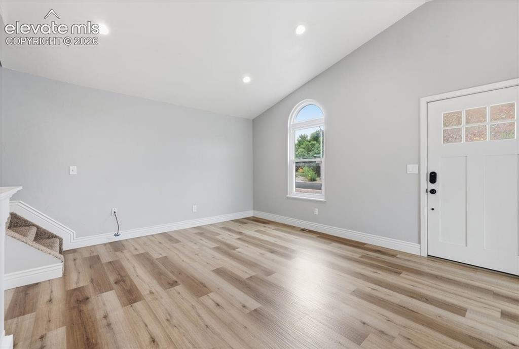 Image 25 of 33: Vaulted Living Room with Laminate Flooring!