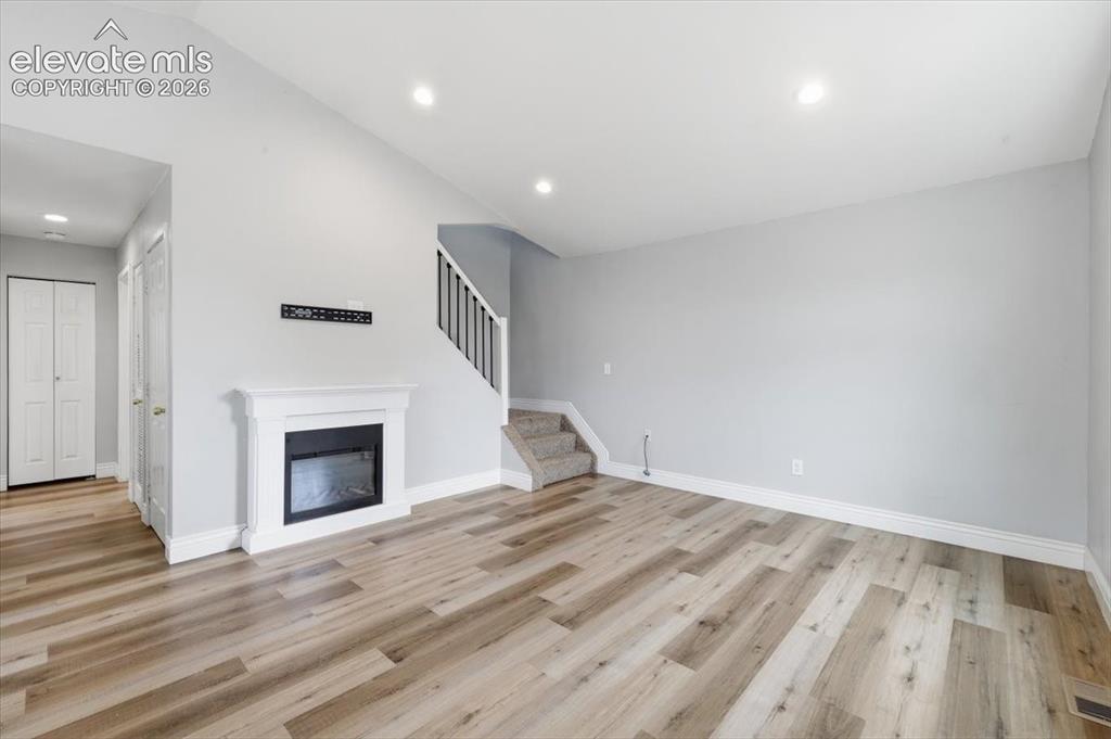 Image 26 of 33: Vaulted Living Room with Laminate Flooring!