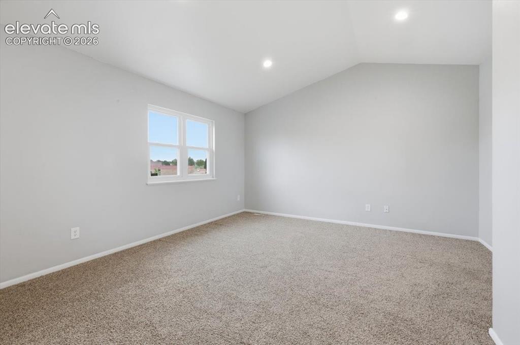 Image 28 of 33: Vaulted Primary Suite with Walk-in Closet!