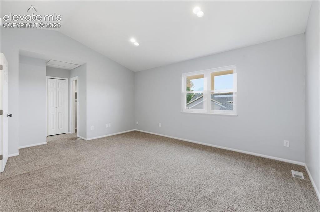 Image 29 of 33: Vaulted Primary Suite with Walk-in Closet!