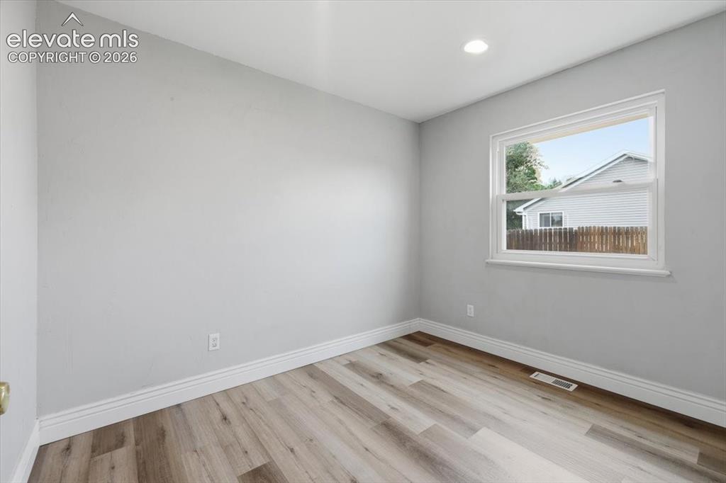 Image 32 of 33: Main Level Bedroom with Laminate Flooring!