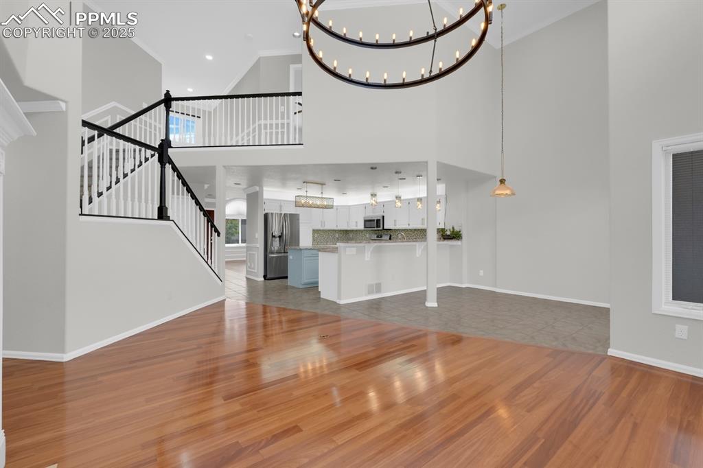 Image 7 of 41: Open living room featuring wood floors