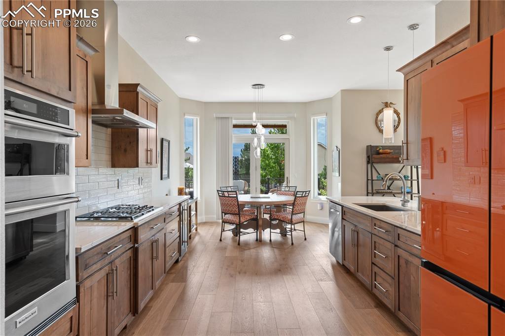 Image 11 of 50: Hardwood floor in kitchen