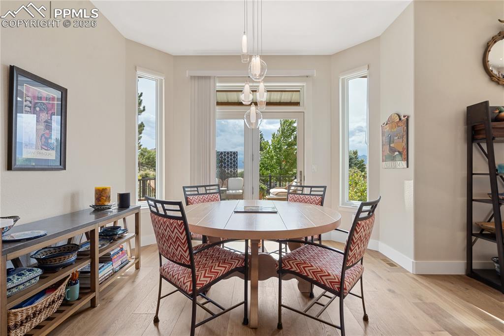 Image 12 of 50: Eat in kitchen with newer Renewal by Anderson sliding glass door, newer LED