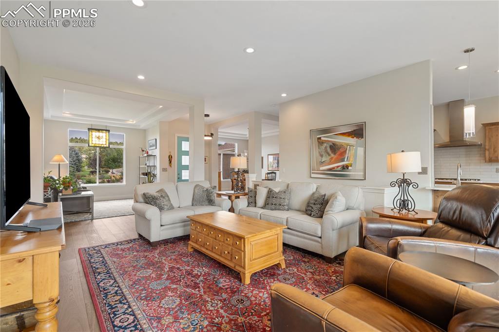 Image 15 of 50: Open, light and bright family room has hardwood floor
