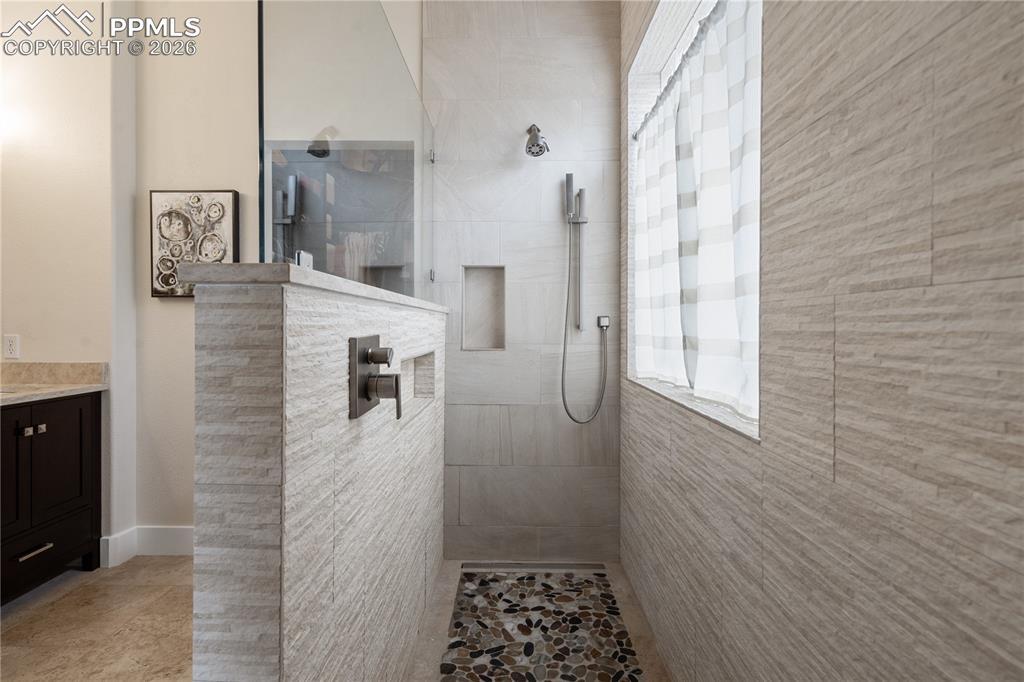 Image 21 of 50: Master bathroom has heated floor