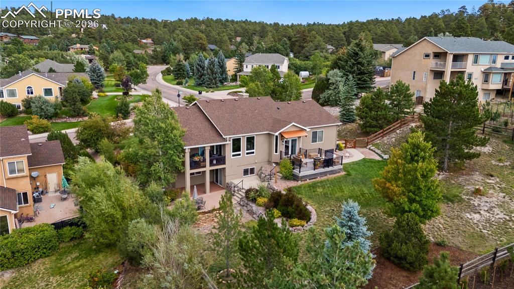 Image 3 of 50: Aerial back view of home, .48 acre lot with fenced backyard