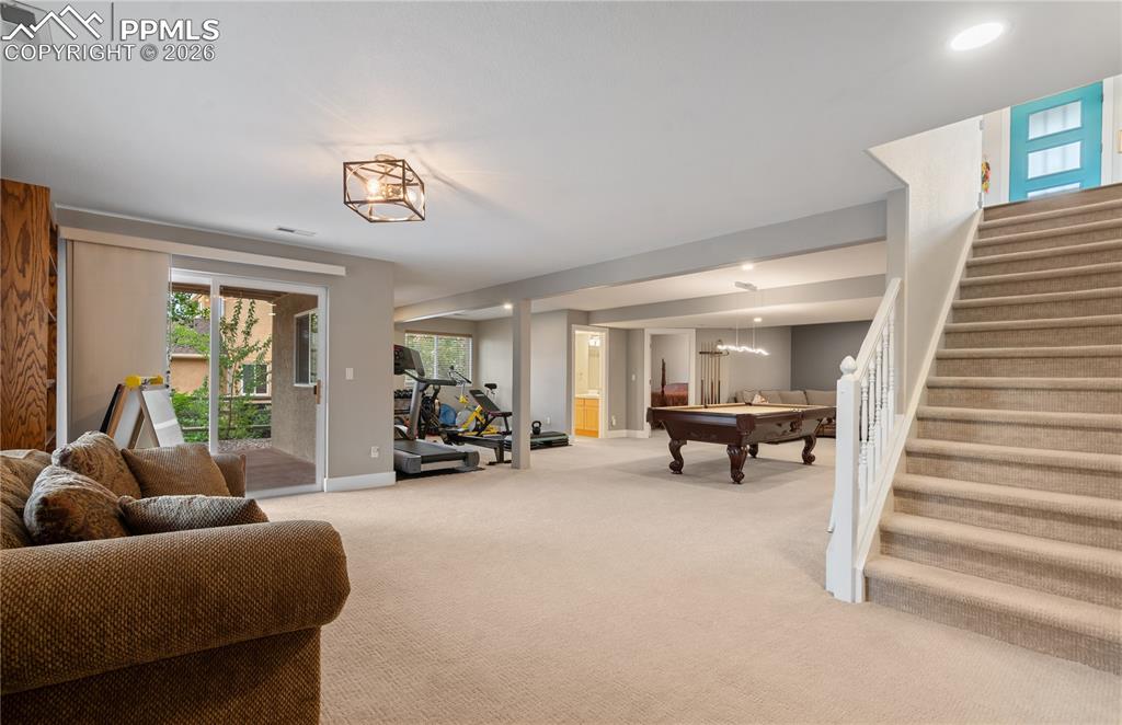 Image 32 of 50: 2nd family room in basement with walk out to concrete patio
