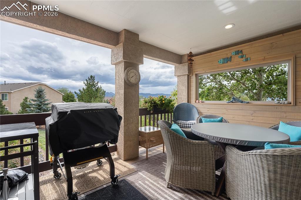 Image 37 of 50: Enclosed and covered 10 x 14 deck with mountain views