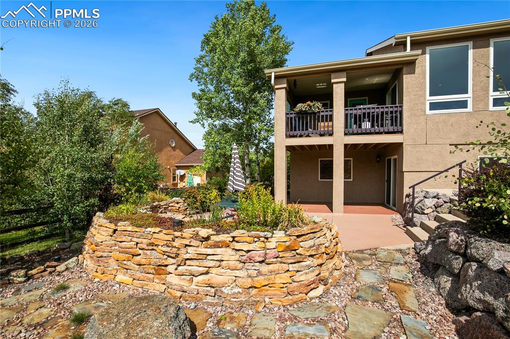 Image 40 of 50: 2 concrete patios for backyard entertaining locations, patio is wired for h