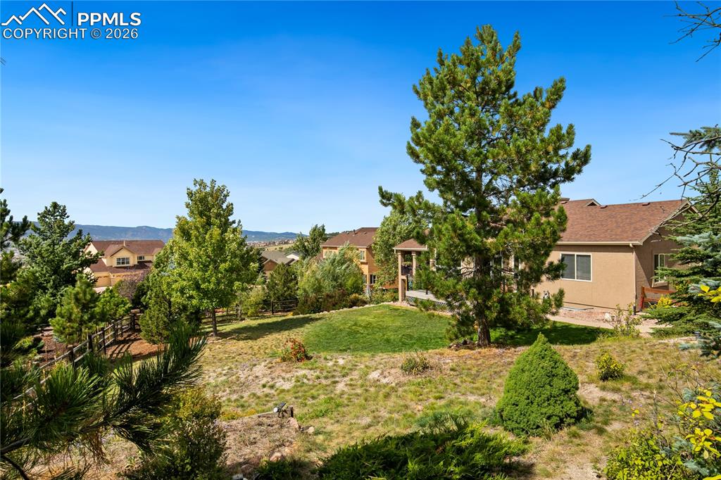 Image 44 of 50: Backyard has fencing and plenty of room for children and pets