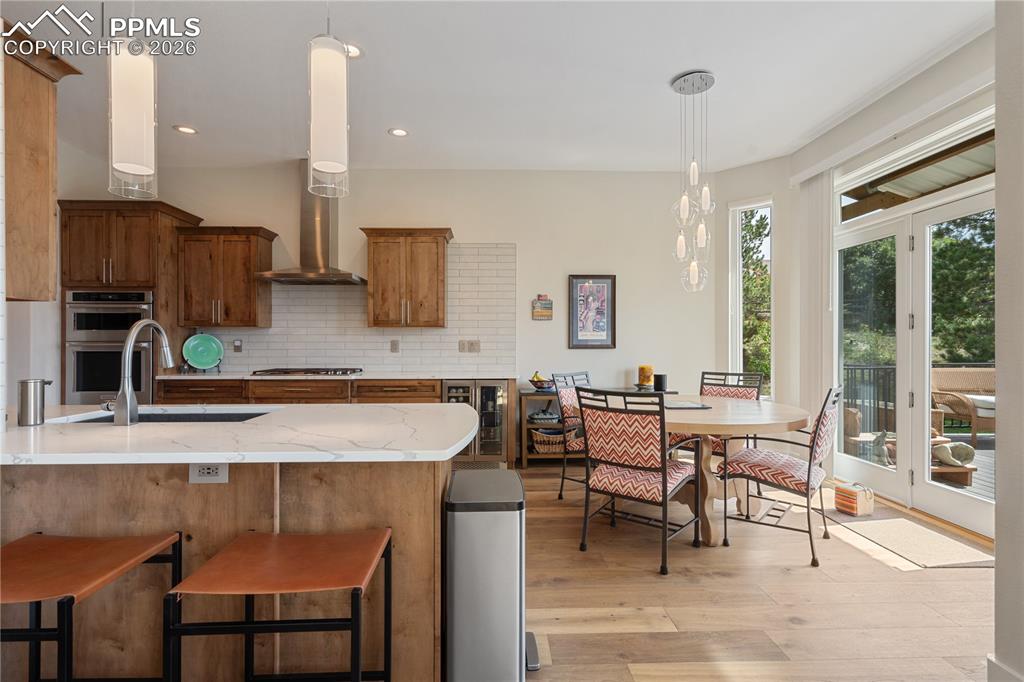 Image 7 of 50: Eat in kitchen with walk out to newer composite deck