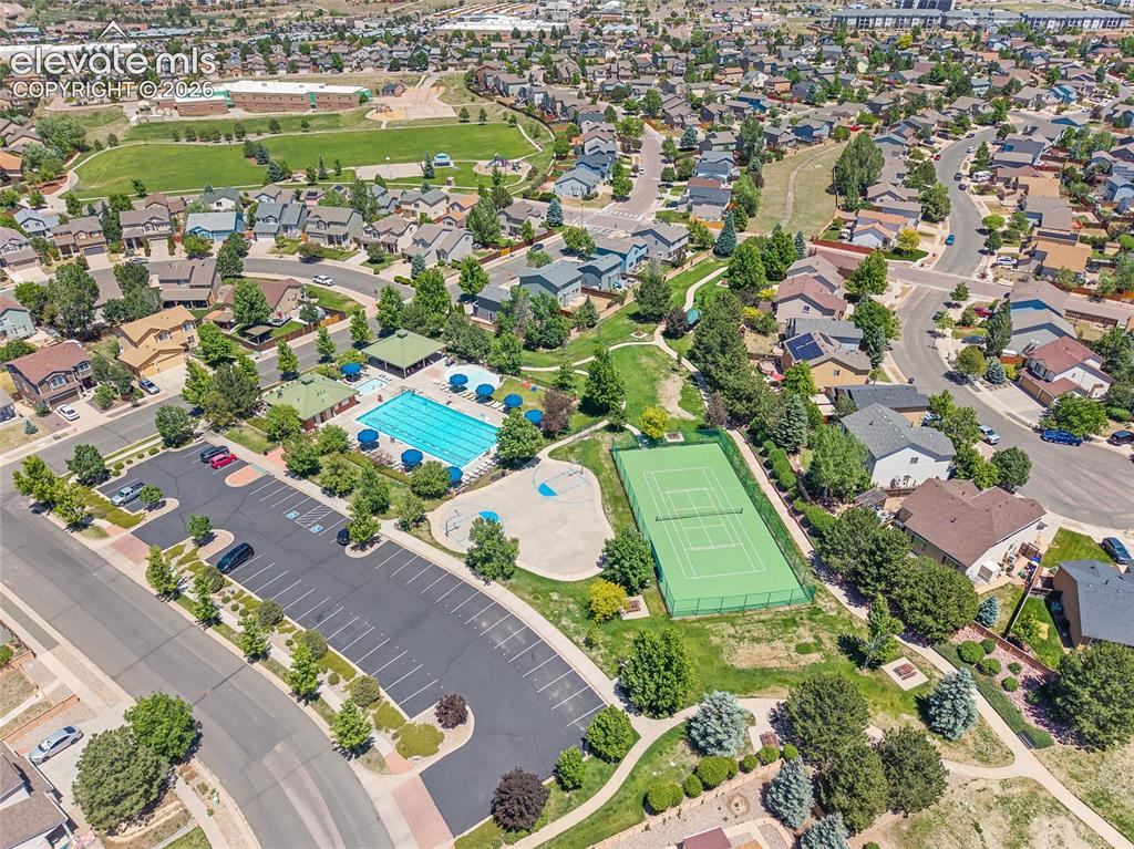 Image 43 of 44: view of community/pool/ tennis court amenities 